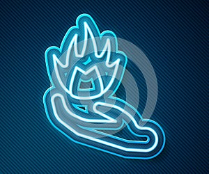 Glowing neon line Hand holding a fire icon isolated on blue background. Vector