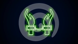 Glowing neon line Handcuffs on hands of criminal man icon isolated on black background. Arrested man in handcuffs. A