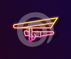 Glowing neon line Hang glider icon isolated on black background. Extreme sport. Vector Illustration