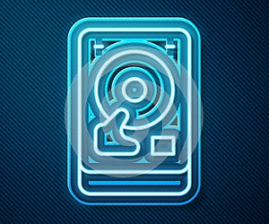 Glowing neon line Hard disk drive HDD icon isolated on blue background. Vector