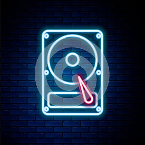 Glowing neon line Hard disk drive HDD icon isolated on brick wall background. Colorful outline concept. Vector
