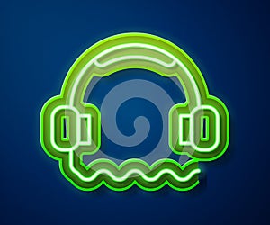 Glowing neon line Headphones icon isolated on blue background. Support customer service, hotline, call center, faq