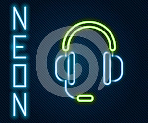 Glowing neon line Headphones with microphone icon isolated on black background. Colorful outline concept. Vector