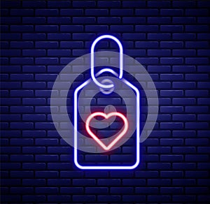 Glowing neon line Heart tag icon isolated on brick wall background. Love symbol. Valentine day symbol. Colorful outline