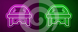 Glowing neon line Hockey helmet icon isolated on purple and green background. Vector