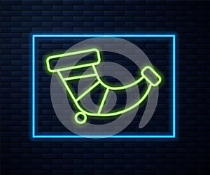 Glowing neon line Hunting horn icon isolated on brick wall background. Vector