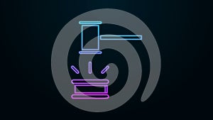 Glowing neon line Judge gavel icon isolated on black background. Gavel for adjudication of sentences and bills, court