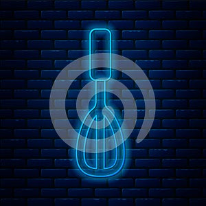 Glowing neon line Kitchen whisk icon isolated on brick wall background. Cooking utensil, egg beater. Cutlery sign. Food