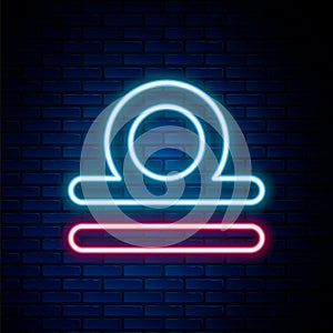 Glowing neon line Libra zodiac sign icon isolated on brick wall background. Astrological horoscope collection. Colorful