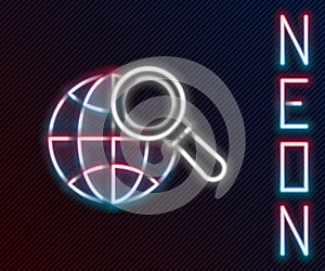 Glowing neon line Magnifying glass with globe icon isolated on black background. Analyzing the world. Global search sign