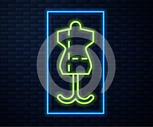 Glowing neon line Mannequin icon isolated on brick wall background. Tailor dummy. Vector