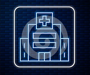 Glowing neon line Medical hospital building with cross icon isolated on brick wall background. Medical center. Health care. Vector