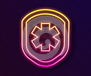 Glowing neon line Medical shield with cross icon isolated on black background. Protection, safety, password security