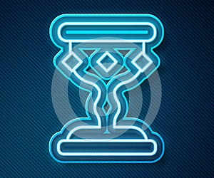 Glowing neon line Medieval goblet icon isolated on blue background. Vector