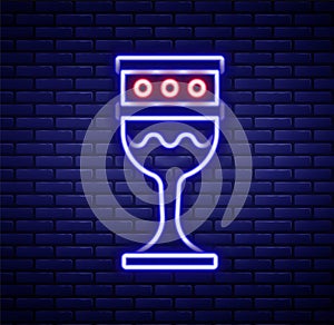 Glowing neon line Medieval goblet icon isolated on brick wall background. Holy grail. Colorful outline concept. Vector