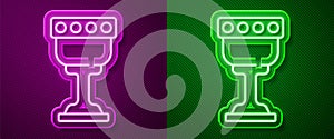 Glowing neon line Medieval goblet icon isolated on purple and green background. Holy grail. Vector