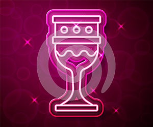 Glowing neon line Medieval goblet icon isolated on red background. Holy grail. Vector