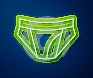 Glowing neon line Men underpants icon isolated on blue background. Man underwear. Vector