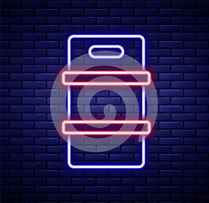Glowing neon line Metal beer keg icon isolated on brick wall background. Colorful outline concept. Vector