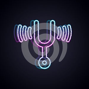 Glowing neon line Musical tuning fork for tuning musical instruments icon isolated on black background. Vector