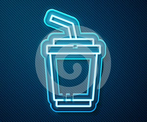Glowing neon line Paper glass with drinking straw and water icon isolated on blue background. Soda drink glass. Fresh
