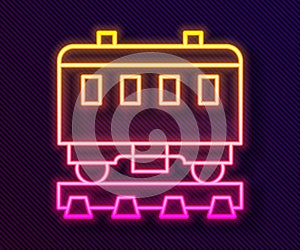 Glowing neon line Passenger train cars icon isolated on black background. Railway carriage. Vector