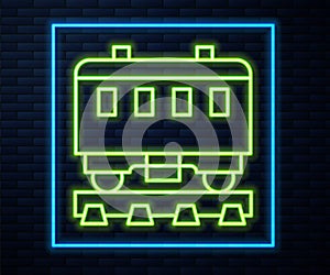 Glowing neon line Passenger train cars icon isolated on brick wall background. Railway carriage. Vector