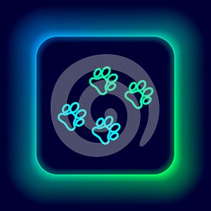 Glowing neon line Paw print icon isolated on black background. Dog or cat paw print. Animal track. Colorful outline