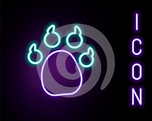 Glowing neon line Paw print icon isolated on black background. Dog or cat paw print. Animal track. Colorful outline