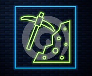 Glowing neon line Pickaxe icon isolated on brick wall background. Vector