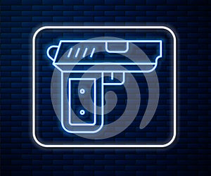 Glowing neon line Pistol or gun icon isolated on brick wall background. Police or military handgun. Small firearm