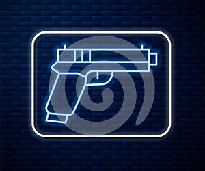 Glowing neon line Pistol or gun icon isolated on brick wall background. Police or military handgun. Small firearm