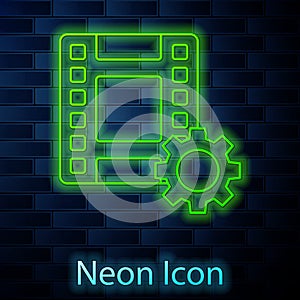 Glowing neon line Play Video icon isolated on brick wall background. Film strip sign. Vector