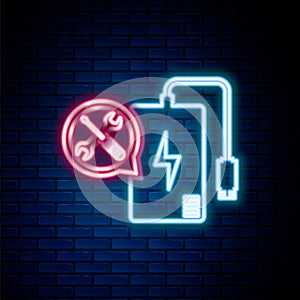 Glowing neon line Power bank with screwdriver and wrench icon isolated on brick wall background. Adjusting, service