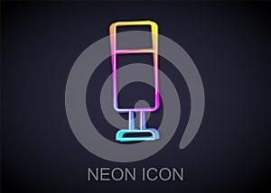 Glowing neon line Punching bag icon isolated on black background. Vector