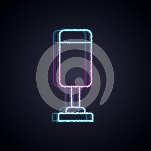 Glowing neon line Punching bag icon isolated on black background. Vector