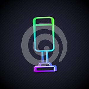 Glowing neon line Punching bag icon isolated on black background. Vector