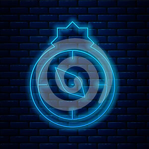 Glowing neon line Qibla icon isolated on brick wall background. Qibla Islamic Arab term used for the direction for