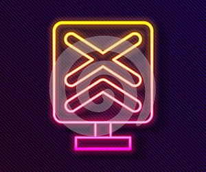 Glowing neon line Railroad crossing icon isolated on black background. Railway sign. Vector