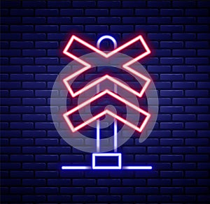 Glowing neon line Railroad crossing icon isolated on brick wall background. Railway sign. Colorful outline concept