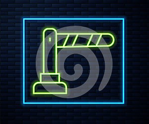Glowing neon line Railway barrier icon isolated on brick wall background. Vector
