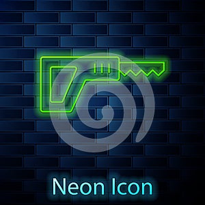Glowing neon line Reciprocating saw and saw blade icon isolated on brick wall background. Vector