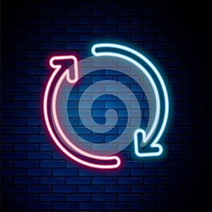 Glowing neon line Refresh icon isolated on brick wall background. Reload symbol. Rotation arrows in a circle sign