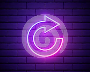 Glowing neon line Refresh icon isolated on brick wall background. Reload symbol. Rotation arrows in a circle sign