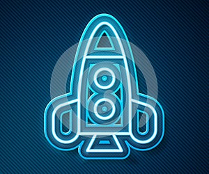 Glowing neon line Rocket ship toy icon isolated on blue background. Space travel. Vector