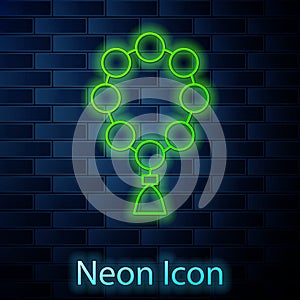 Glowing neon line Rosary beads religion icon isolated on brick wall background. Vector Illustration