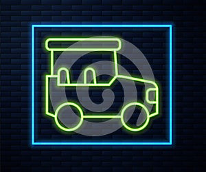 Glowing neon line Safari car icon isolated on brick wall background. Vector