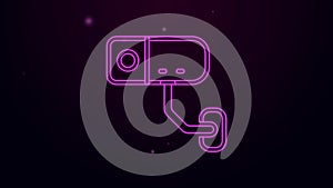 Glowing neon line Security camera icon isolated on black background. 4K Video motion graphic animation