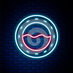 Glowing neon line Ship porthole with rivets and seascape outside icon isolated on brick wall background. Colorful