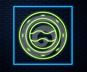 Glowing neon line Ship porthole with rivets and seascape outside icon isolated on brick wall background. Vector